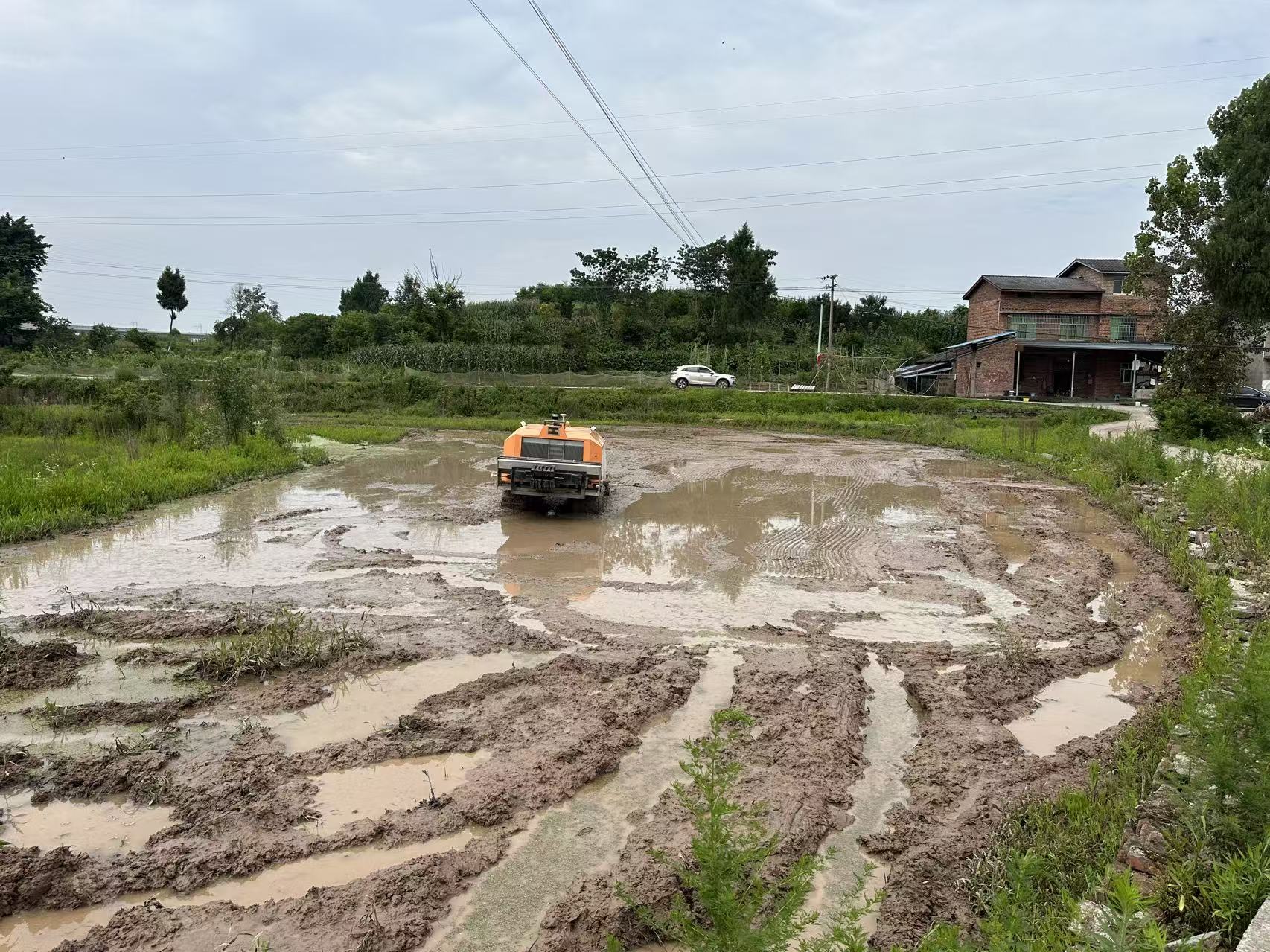 Autonomous agricultural robot under test in a muddy field